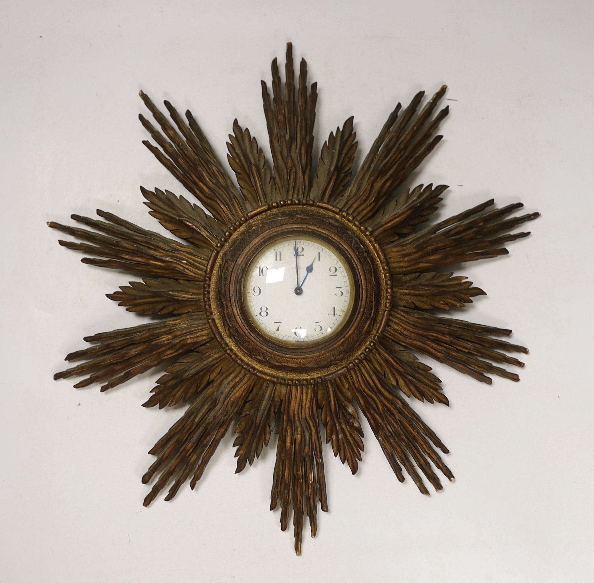 A giltwood starburst wall timepiece, 47cm high